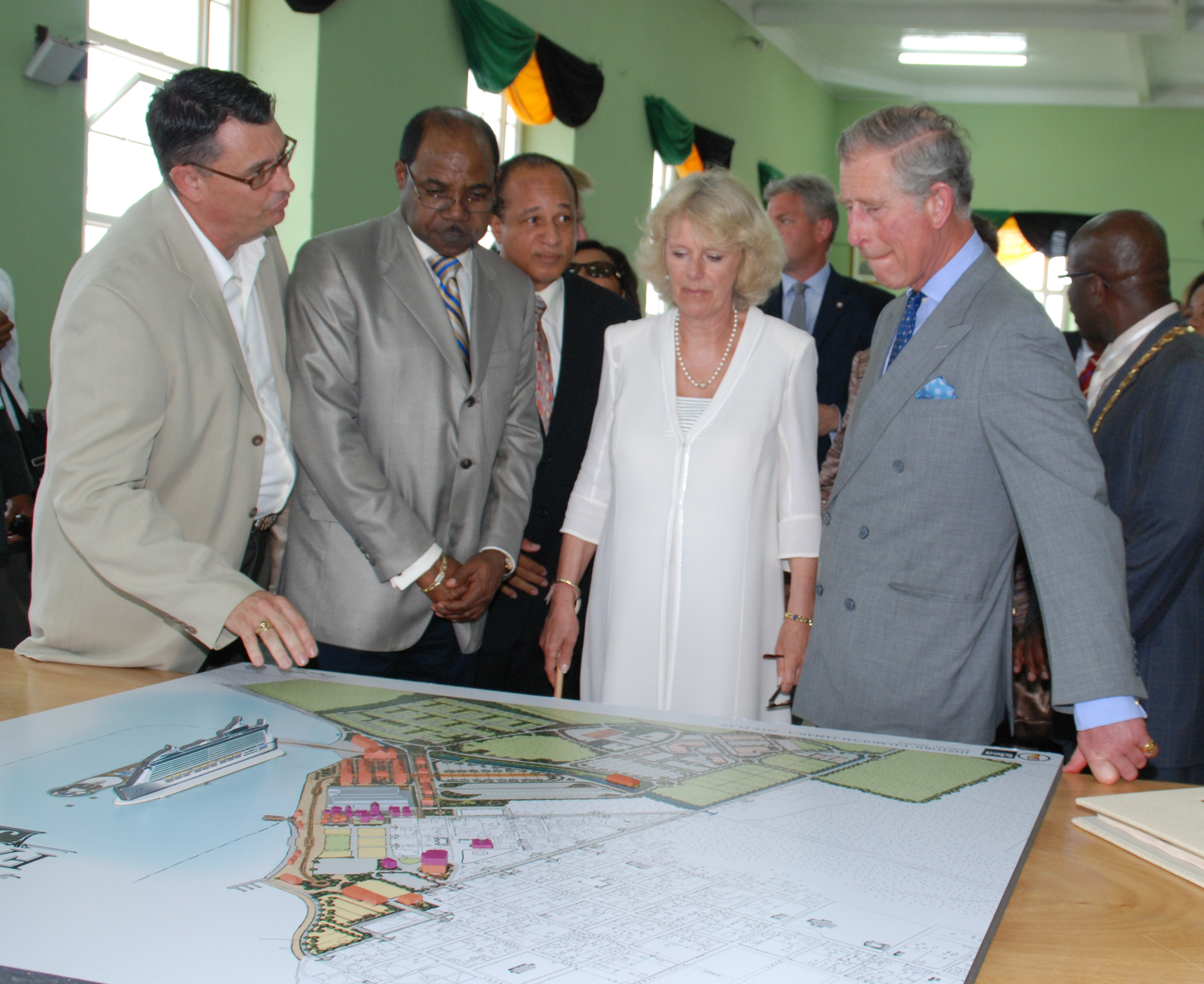 Their Royal Highnesses Prince of Wales (2nd right) and Duchess of Cornwall (centre) listen attentively to development plans for the 18th Century Commercial Capital, Falmouth from Idea's Hugh Darley on Thursday afternoon. Minister of Tourism, Edmund Bartlett (2nd left) and Custos Roylan Barrett share in the occassion.